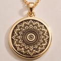 Evil Eye Mandala Pendant Necklace - 14K solid gold charm showing front view with detailed engraving and polished finish.
