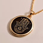 Rose Gold Plated Hamsa pendant with Evil Eye charm, a symbol of divine protection and harmony. Feminine and meaningful gift choice for birthdays, holidays, or spiritual milestones.