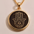 Rose Gold Plated Hamsa pendant with Evil Eye charm, a symbol of divine protection and harmony. Feminine and meaningful gift choice for birthdays, holidays, or spiritual milestones.