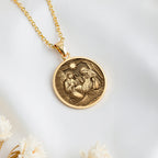 Holy Family Nativity Scene Pendant Necklaces 14K 14K Gold Plated pendant necklace featuring a circular religious scene design.
