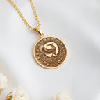 14K solid gold Horus Falcon God Pendant: round  of Horus Egyptian sky god with engraved...