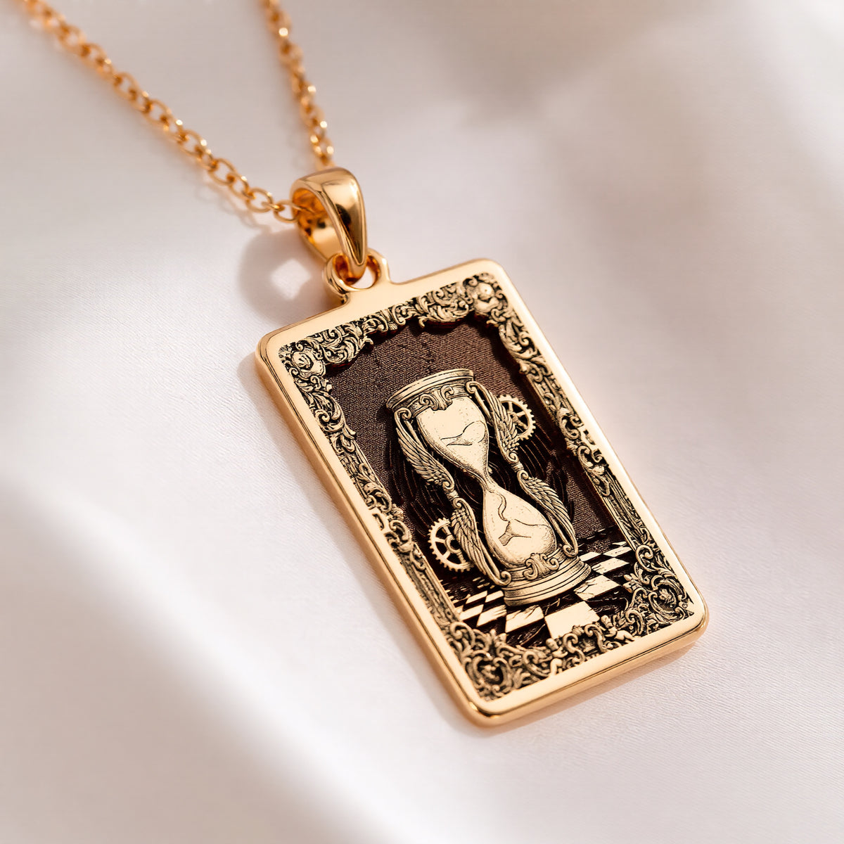 Hourglass Sands of Time Necklace Necklaces 14K 14K Gold Plated rectangular pendant with draped classical figure design and ornate border necklace