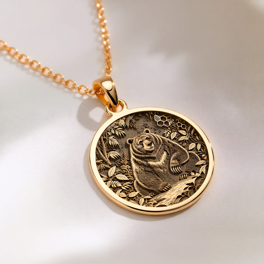 Jungle Bear Spirit Animal Pendant Necklaces 14K 14K Gold Plated pendant necklace featuring a bear surrounded by foliage in a circular design.