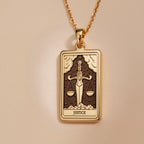 Justice Tarot Major Arcana Pendant Necklaces 14K 14K Gold Plated-toned pendant necklace featuring a square scales of justice design with the word JUSTICE.