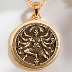 Kali Ma Divine Feminine Pendant Necklaces 14K 14K Gold Plated pendant necklace featuring a round design of a deity with multiple heads and skulls.