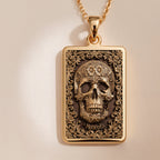Skull & Bones Memento Mori Pendant Necklaces Yellow gold skull pendant with ornate floral scrollwork design necklace