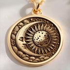 A gold necklace with a round pendant featuring a celestial sun and moon design. The intricate details symbolize harmony and cosmic balance, making it a perfect accessory for lovers of unique, symbolic jewelry. Ideal for both daily wear and special.