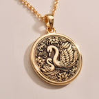 Rose Gold Plated Mother Baby Swan Medallion featuring protective mother swan with baby cygnet surrounded by ornate decorative elements. Elegant family jewelry with detailed maternal symbolism. Warm-toned love talisman.