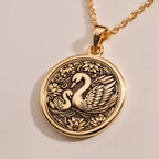Rose Gold Plated Mother Baby Swan Pendant with family design. Warm-toned maternal swan medallion with baby cygnet and decorative elements. Family jewelry celebrating maternal bonds, perfect Mother's Day gift.