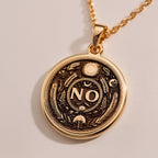 Rose Gold Plated NO Pendant with boundary affirmation design. Warm-toned self-respect medallion with detailed evil eye, moon and botanical motifs. Empowerment jewelry celebrating personal limits and conscious decision-making.