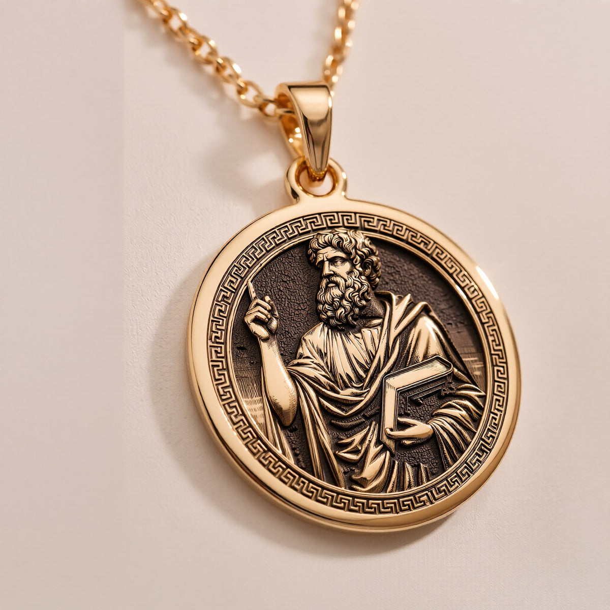 An heirloom-quality 14K solid gold Plato medallion. The art shows the Greek philosopher, symbolizing wisdom, a precious philosophy gift.
