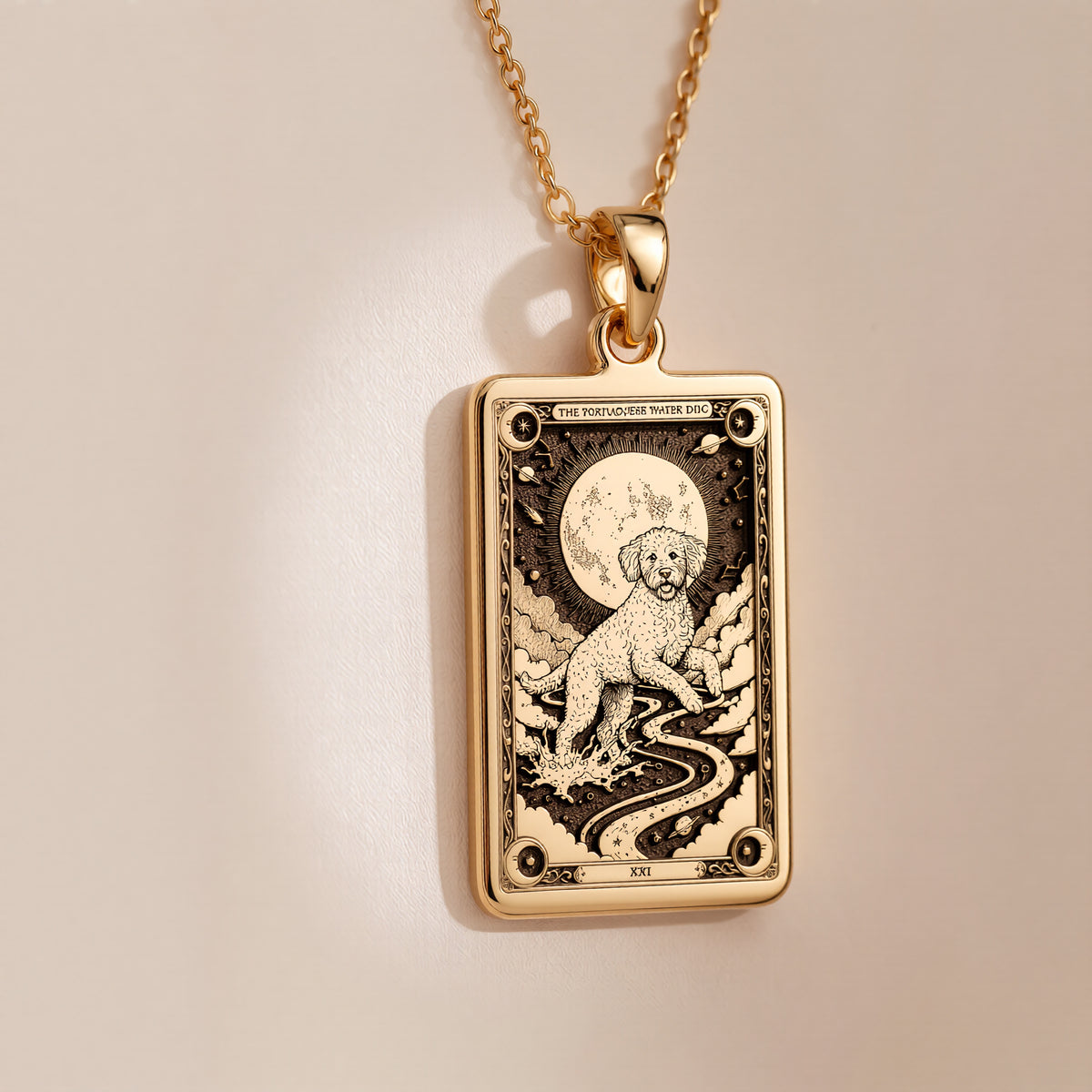 An heirloom-quality 14K solid gold Portuguese Water Dog tarot pendant. The art shows the dog on a river path, symbolizing adventure, a precious dog mom gift.