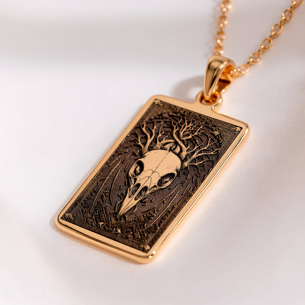 Raven Skull Pendant Necklace Necklaces Yellow gold skull pendant with root design in a rectangular frame necklace