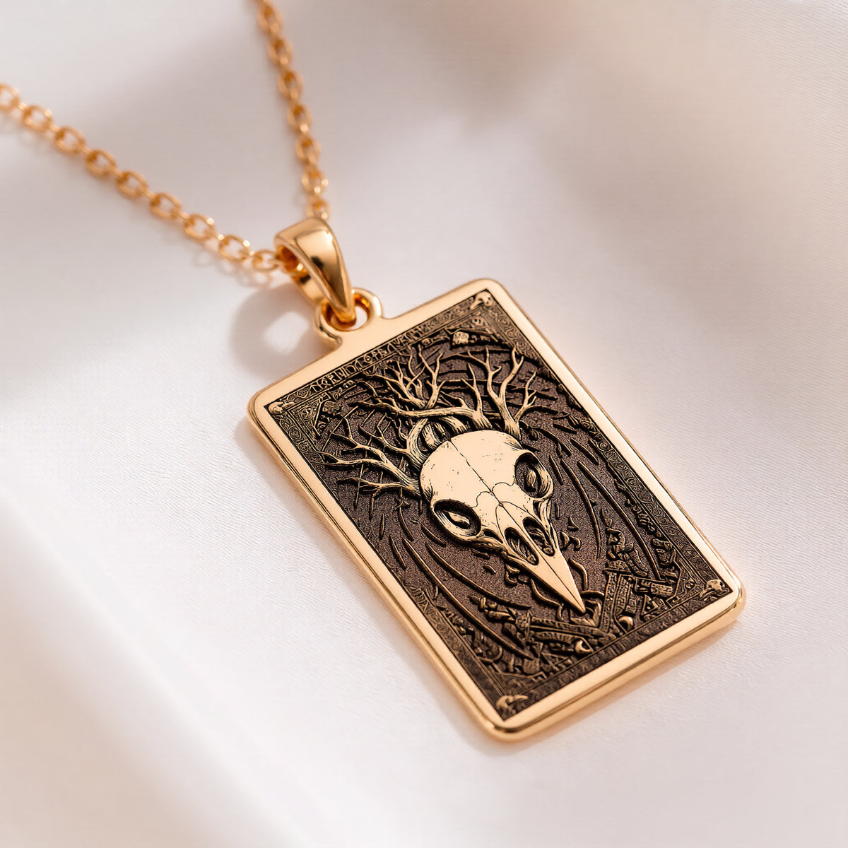 Raven Skull Pendant Necklace Necklaces Yellow gold square pendant necklace featuring a skull face design with branches.