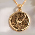 Front studio view of 14K solid yellow gold Sagittarius Centaur zodiac medallion necklace depicting Chiron drawing his bow.