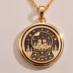 Rose gold plated snow globe pendant featuring two cats in a whimsical coin-style medallion. Handmade and elegant, perfect gift for cat lovers and special occasions.