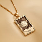 Sun Tarot Major Arcana Pendant Necklaces Yellow gold sun and clouds pendant necklace with rectangular box frame