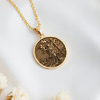 Lady of the Lake Excalibur Charm Necklace Necklaces 14K 14K Gold Plated pendant necklace featuring a round design of a draped female figure against a starry background.