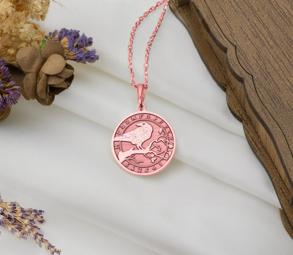 Rose gold plated Celtic raven necklace pendant, a spiritual charm representing resilience and mystery. This lightweight, elegant piece is ideal for layering, blending mysticism with elegance, and is a thoughtful gift for any occasion.