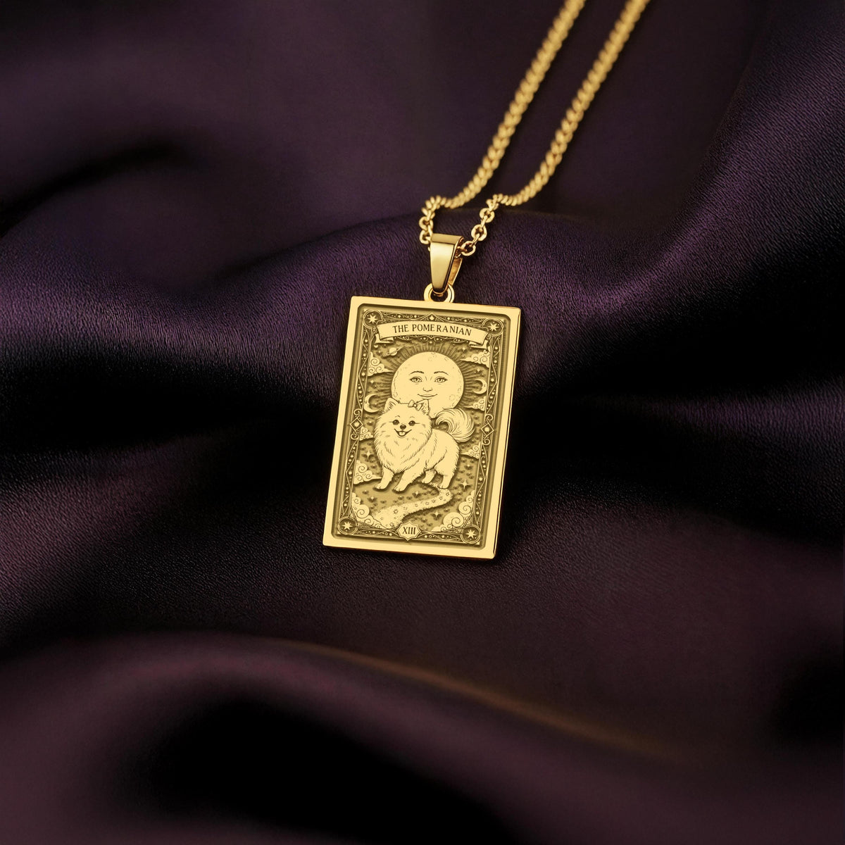 An heirloom-quality 14K solid gold Pomeranian tarot pendant. The art shows the fluffy dog in a "Sun" card, symbolizing a sunny personality, a precious dog mom gift.