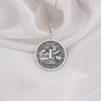 925 Sterling Silver Lighthouse Medallion showcasing coastal tower with detailed seascape. Intricate maritime coin pendant with cloudy sky and rocky shoreline. Premium nautical jewelry symbolizing guidance and unwavering protection.
