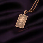 A unique rose gold plated rectangular necklace with a custom engraved portrait of the King of Beasts. The detailed artwork is a powerful symbol of courage and strength, a perfect gift for him.