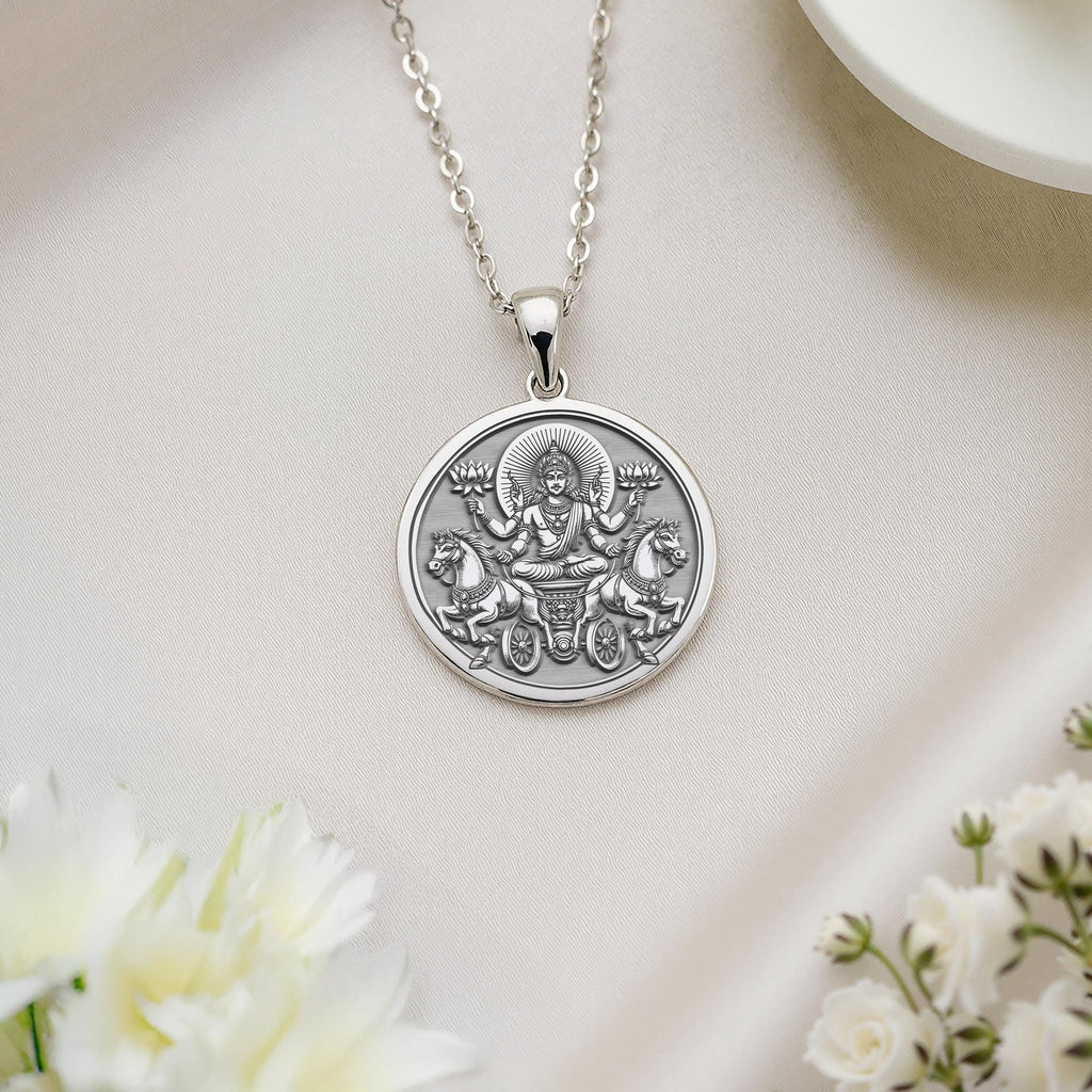 Polished silver Surya talisman capturing divine radiance from Vedic tales, fueling bold journeys – add this Hindu folklore necklace to your collection.
