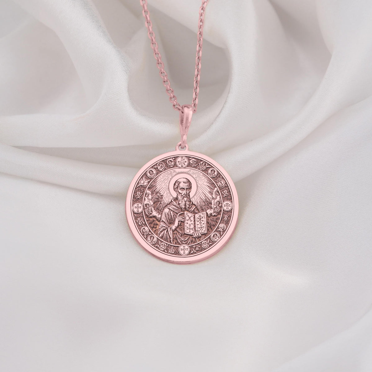 Rose Gold Plated Saint Dionysius Areopagite Medallion featuring revered Orthodox saint with holy book and celestial halo surrounded by sacred crosses. Elegant religious jewelry with detailed Christian symbolism. Warm-toned faith talisman.