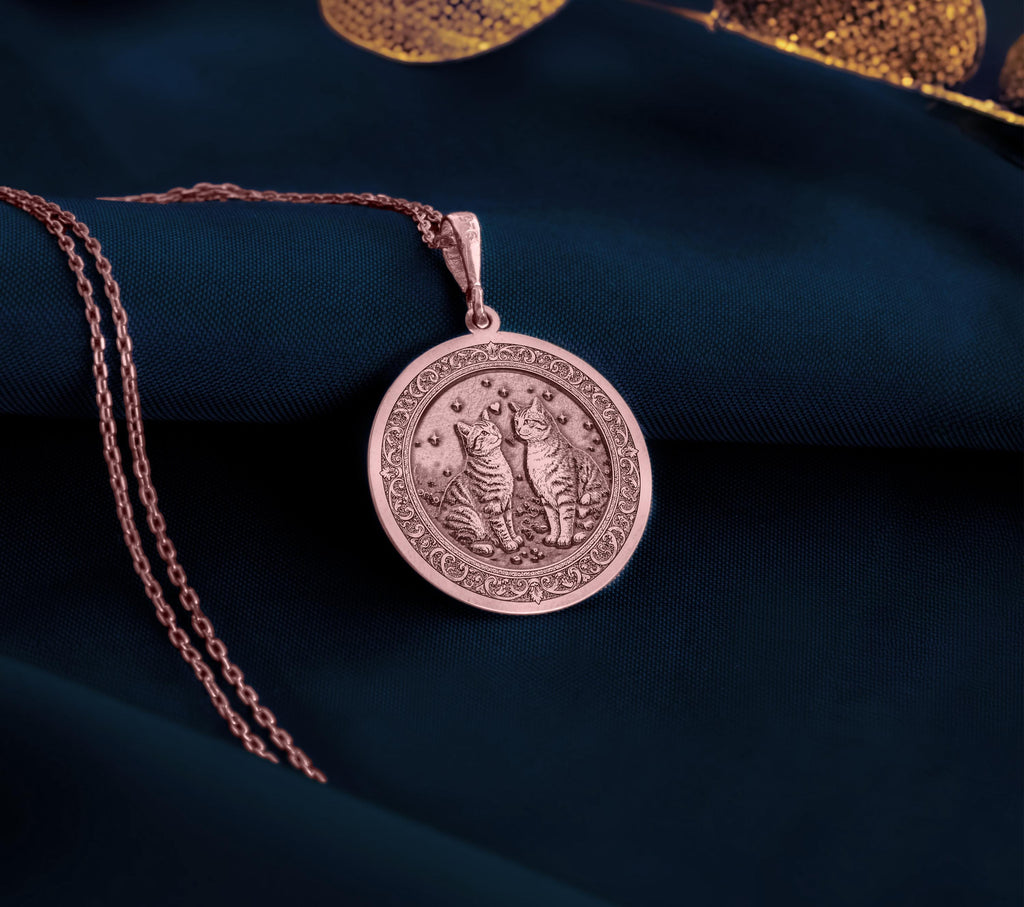 Rose Gold Plated Twin Cats Pendant with celestial memorial design. Warm-toned bonded cat pair medallion with detailed starlit background and ornate features. Memorial jewelry celebrating eternal love, perfect for grieving cat parents.
