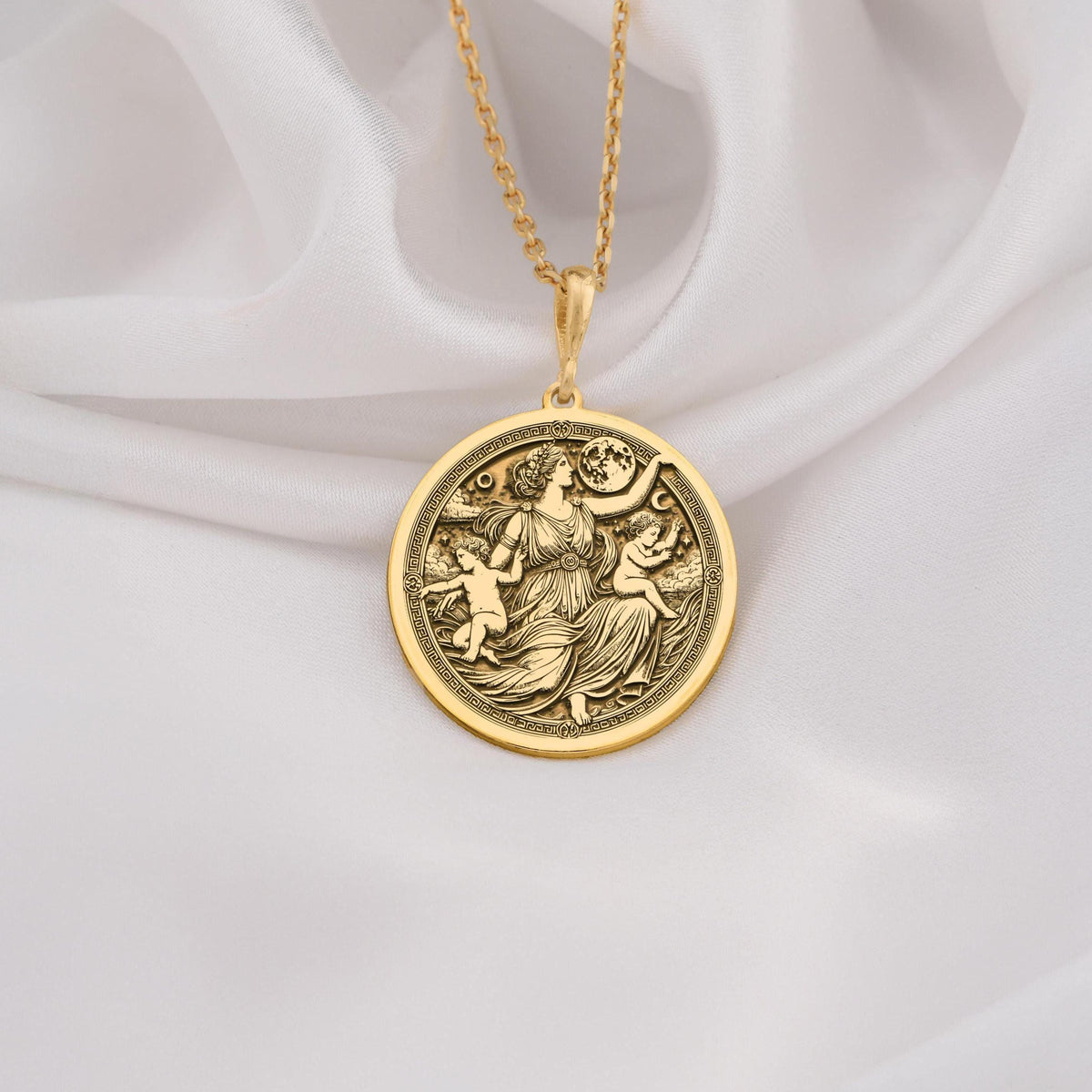 Leto Goddess Necklace Necklaces 14K 14K Gold Plated pendant necklace featuring a round classical figures design on white fabric.
