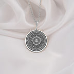 Sterling silver sun pendant necklace with intricate sunburst design, ideal as a gift for spiritual souls and celestial jewelry collectors.