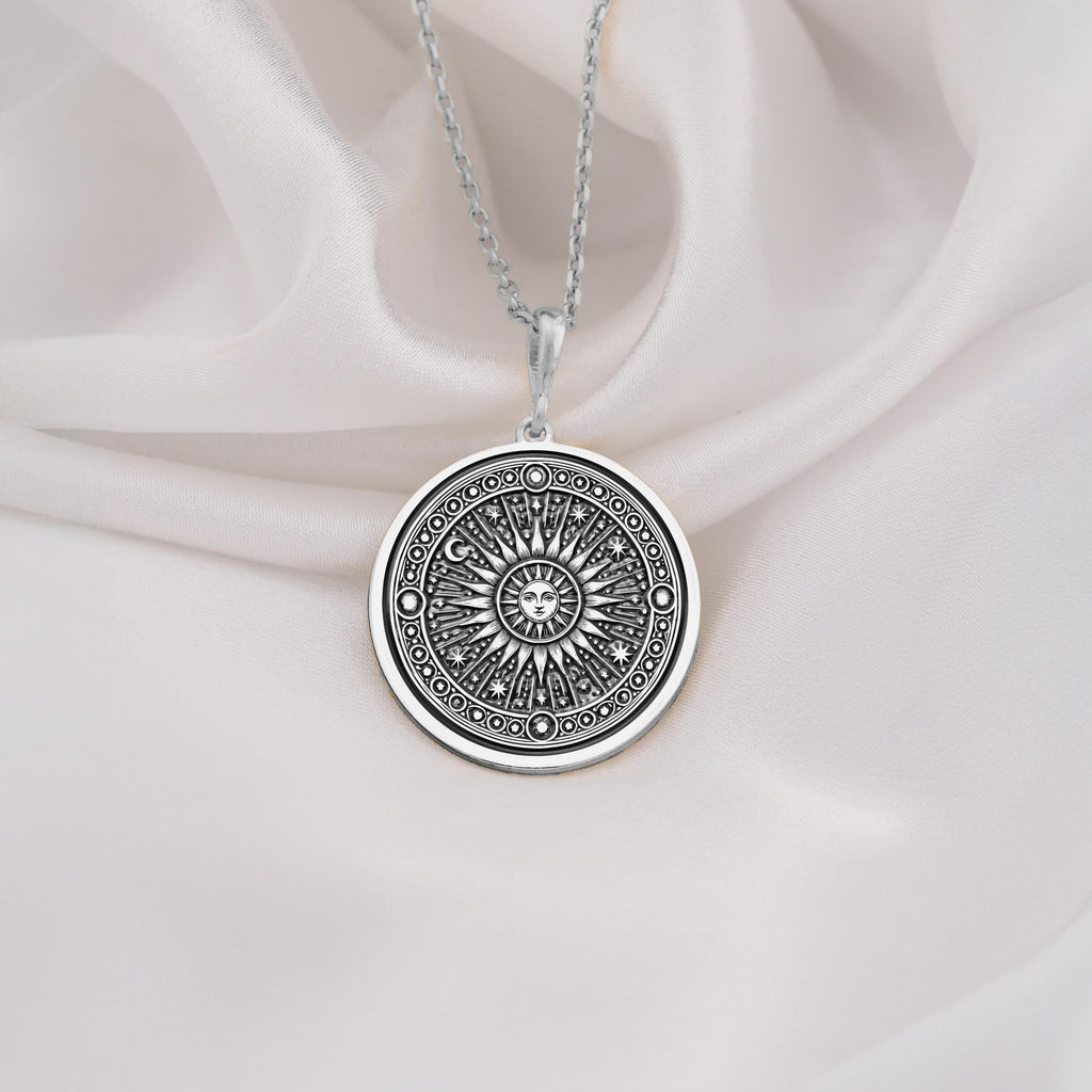 Sterling silver sun pendant necklace with intricate sunburst design, ideal as a gift for spiritual souls and celestial jewelry collectors.