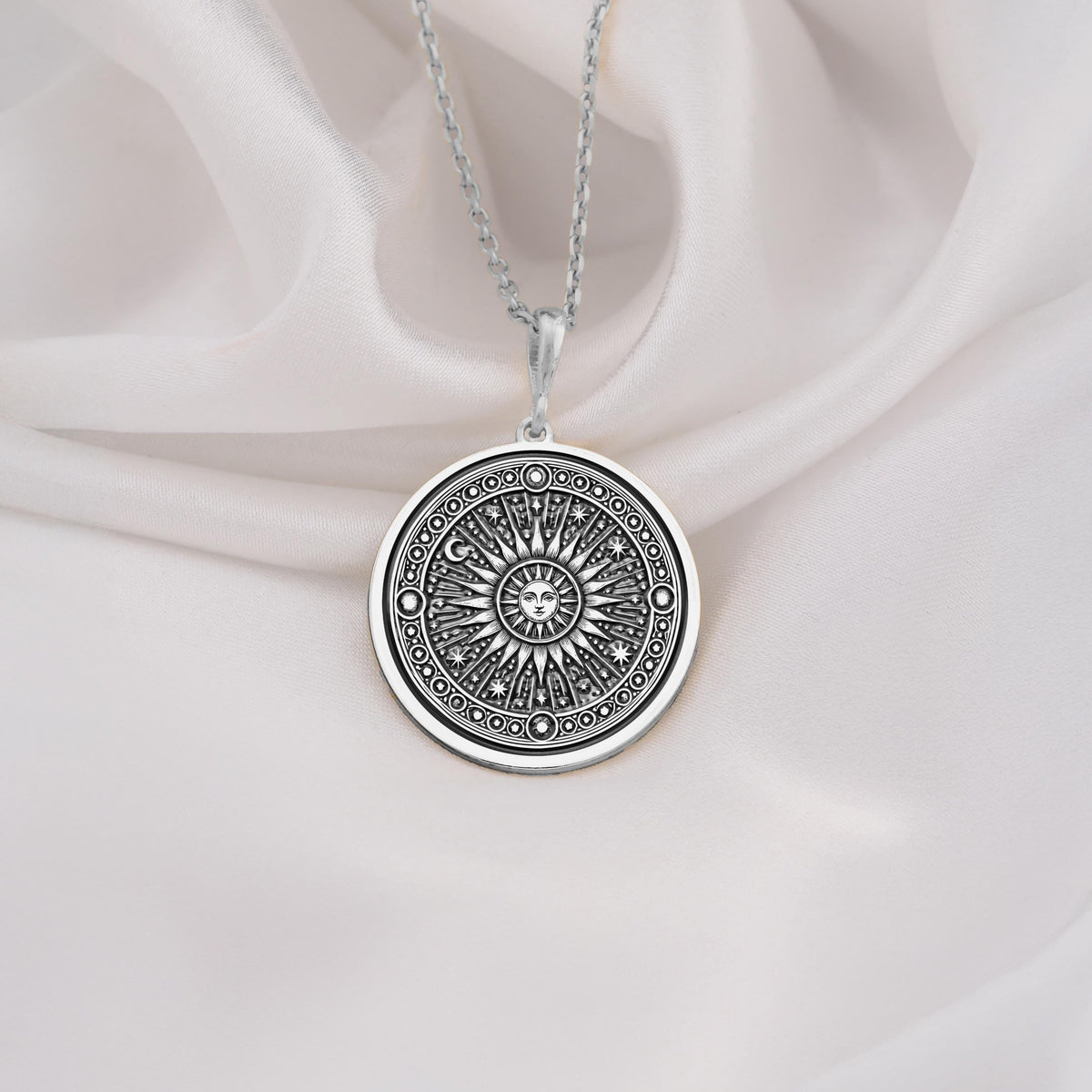 Sterling silver sun pendant necklace with intricate sunburst design, ideal as a gift for spiritual souls and celestial jewelry collectors.