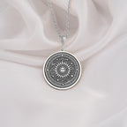 Sterling silver sun pendant necklace with intricate sunburst design, ideal as a gift for spiritual souls and celestial jewelry collectors.