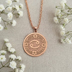 Cancer Crab Astrological Medallion Pendants Rose 14K Rose 14K 14K Rose 14K 14K Rose Gold Plated circular pendant with ornate floral design and swirl motif necklace