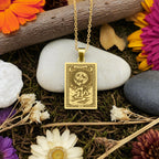 A handmade 14K gold plated Schnauzer necklace. The engraving captures the distinguished dog in a "Moon" tarot card style.