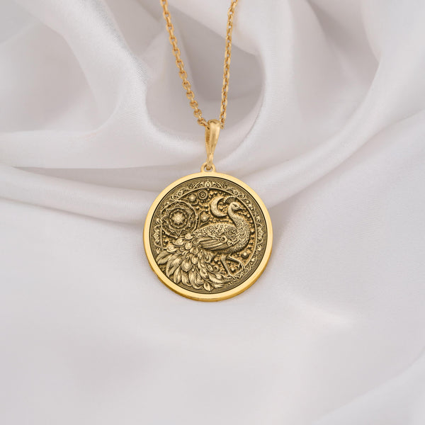 Exquisite 14K Solid Gold peacock necklace with mandala and celestial engravings. A symbolic and elegant bird pendant for women.