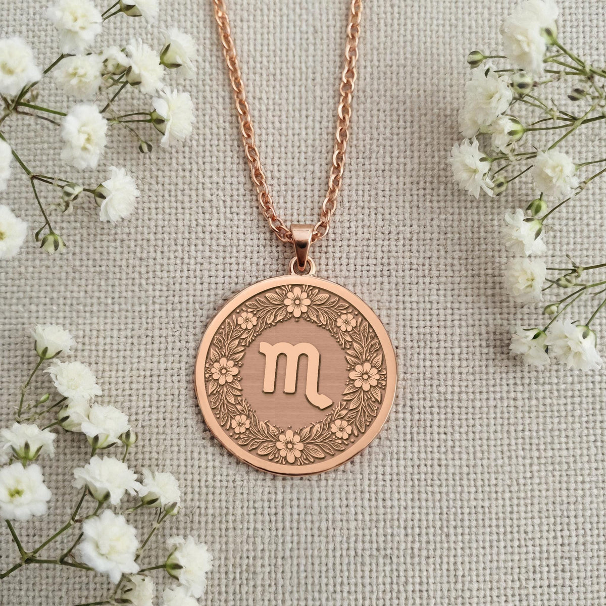 Engravable Rose Gold Plated Scorpio Pendant. The floral horoscope medallion is a perfect personalized gift for an October or November birthday. Customizable celestial jewelry.