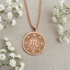 Engravable Rose Gold Plated Scorpio Pendant. The floral horoscope medallion is a perfect personalized gift for an October or November birthday. Customizable celestial jewelry.