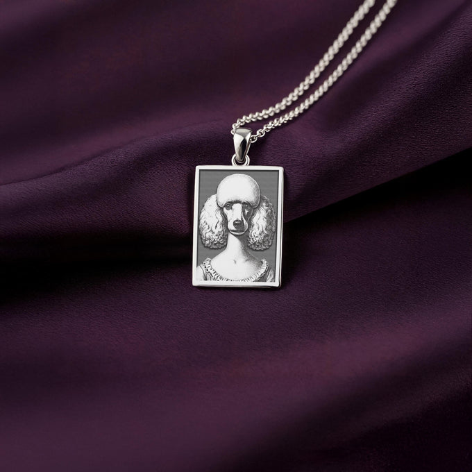 A polished 925 sterling silver rectangle pendant with a custom laser-etched portrait of an elegant French Poodle, ideal as a dog memorial gift.