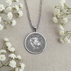 Sterling Silver Sacred Stag Pendant with detailed Celtic forest design. Handcrafted silver coin charm featuring woodland deer with antlers and ornate elements. Nature jewelry celebrating Celtic stag wisdom and forest spiritual bonds.