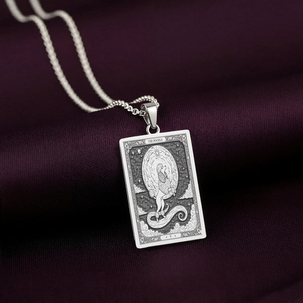 A handmade 14K gold plated Poodle necklace. The engraving captures the highly stylized, graceful dog in a unique tarot card style.
