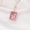 The Rose Gold The Chariot Tarot Necklace is a stunning accessory that combines the elegance of rose gold with the intricate design of tarot symbolism. Crafted from 925K rose gold, this necklace embodies the powerful symbolism of &#39;The Chariot&#39; tarot card, representing courage, victory, and progress. Perfect for tarot enthusiasts and those seeking a stylish accessory, this piece is handmade with high-quality materials, making it ideal for both special occasions and everyday wear.