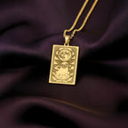 An heirloom-quality 14K solid gold Pug tarot pendant. The art shows the comical dog under the moon, symbolizing its big heart, a precious dog mom gift.