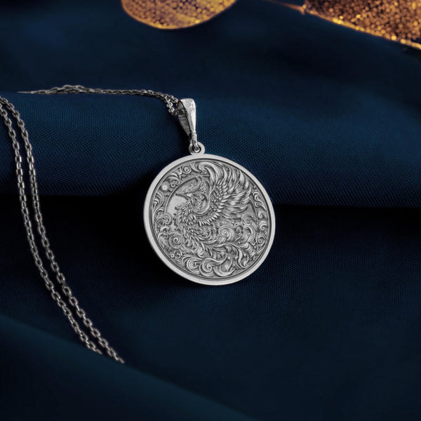 Sterling Silver Phoenix with Gleaming Feathers – A silver phoenix necklace evoking radiant plumage and celestial wings, perfect for those enchanted by mythical bird jewelry and the spiritual elegance it represents.
