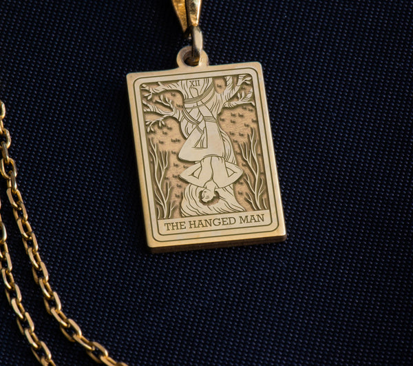 Hanged Man Tarot Necklace Gold, Tarot Jewelry Gold, Spiritual Jewelry Gold, Mystical Jewelry Gold, Occult Jewelry Gold, Gold Tarot Necklace, Hanged Man Pendant Gold, Gold Hanged Man Pendant, Gold Tarot Necklace for Women, Gold Tarot Necklace for Men, Gold Tarot Necklace Gift, Luxury Tarot Necklace Gold, Handmade Tarot Necklace Gold, Unique Tarot Necklace Gold, Gold Jewelry for Transformation, Gold Jewelry for Self-Discovery, Gold Jewelry for Inner Peace, Gold Jewelry for Enlightenment,