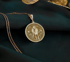 Doberman Pinscher Guardian Dog Pendant Necklaces 14K 14K Gold Plated pendant necklace featuring a stylized sun figure design on a round disc.