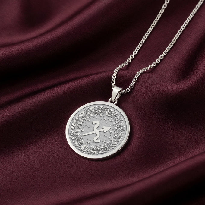 925 Sterling Silver Sagittarius Zodiac Medallion featuring the archer symbol inside a laurel wreath. This celestial coin pendant is engravable, a premium personalized astrology gift.