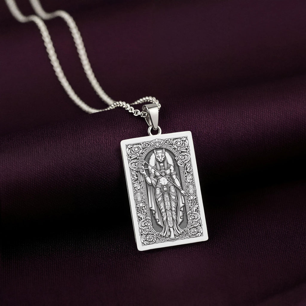 A handcrafted 925 sterling silver Bastet charm, personalized for a practitioner of Kemetic paganism. The design shows the goddess holding her sacred sistrum.