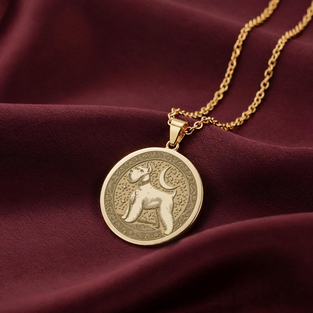 14K Solid Gold Schnauzer medallion featuring a detailed, side-profile engraving of a Schnauzer with its characteristic beard and alert ears. The coin-style pendant has an ornate, patterned border. High-quality dog breed jewelry for pet lovers.